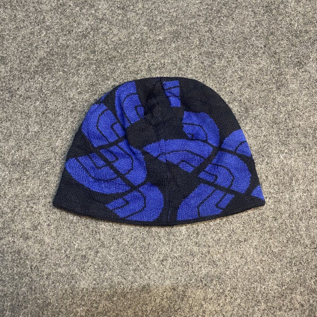 The North Face Reversible Beanie (Category: Caps & Hats) located in Cebu City. Submitted by callmejasonx (Listing ID 1461531725, Image 2). Description: - Brand: The North Face - Color: Blue and Black - Design: Repeating logo pattern - Material: 100% Acrylic - Function: Keeps you warm - Condition: Please check photos for details.