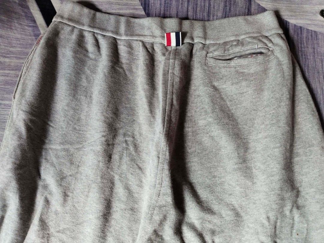 Thom Browne Grey Sweat Shorts Size 2 (Category: Shorts) located in Manila. Submitted by icamalicdem29 (Listing ID 1461399512, Image 2). Description: - Authentic Thom Browne grey sweat shorts - Size 2 - Signature four-stripe detail on left leg - Comfortable elastic waistband with drawstring - Convenient back pocket - Made in Japan.