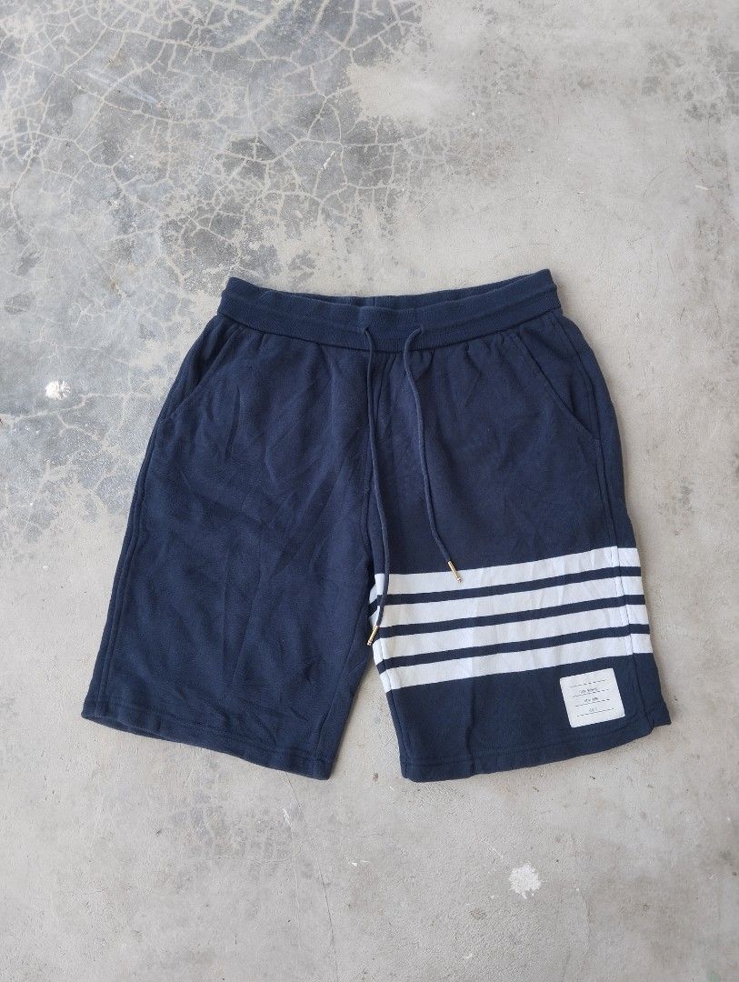 Thom Browne Navy Sweat Shorts Size 3 (Category: Shorts) located in Mati. Submitted by old_era.ph (Listing ID 1461460326, Image 1). Description: - Navy blue Thom Browne sweat shorts - Signature white stripes on the side - Made in Japan - Size 3 - Elastic waistband with drawstring - Ideal for casual wear.