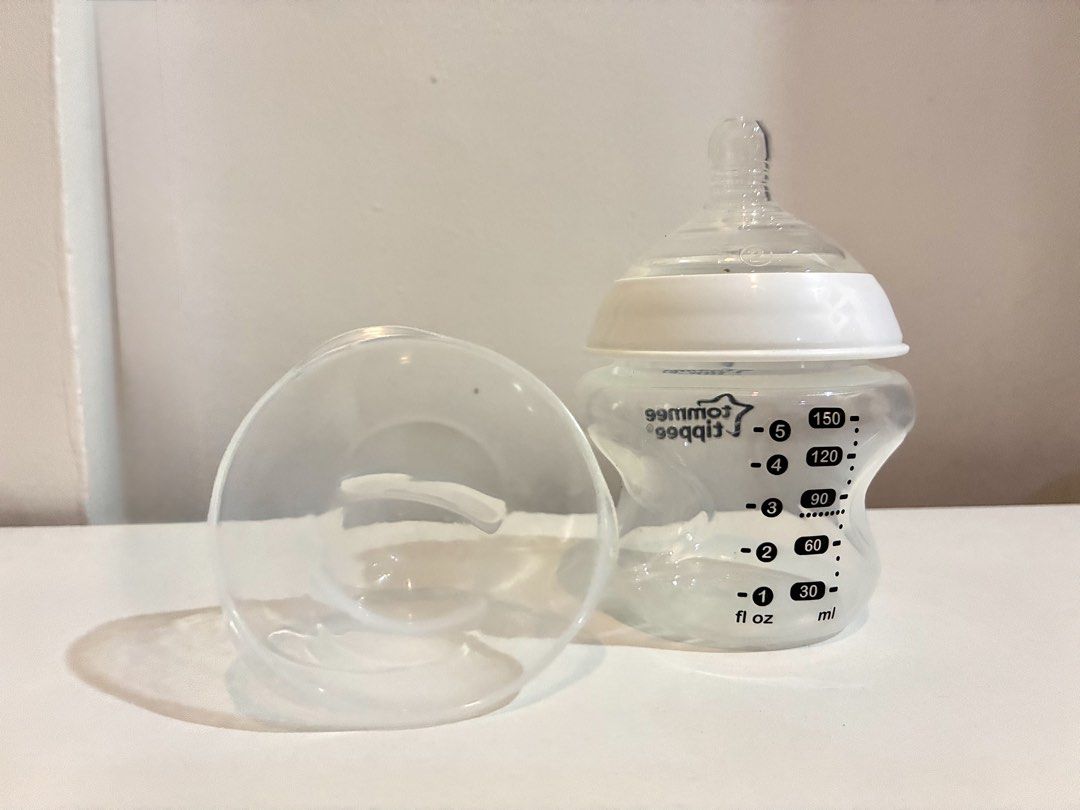 Tommee Tippee Feeding Bottle 150ml / 5oz 0m+ (Category: Breastfeeding & Bottle Feeding) located in Cagayan de Oro. Submitted by xxadl (Listing ID 1461326966, Image 1). Description: - Tommee Tippee Feeding Bottle - Capacity: 150ml (5oz) - Suitable from birth (0m+) - Includes teat and cap - Easy-grip shape for comfortable handling - Clear measurement markings on the side.