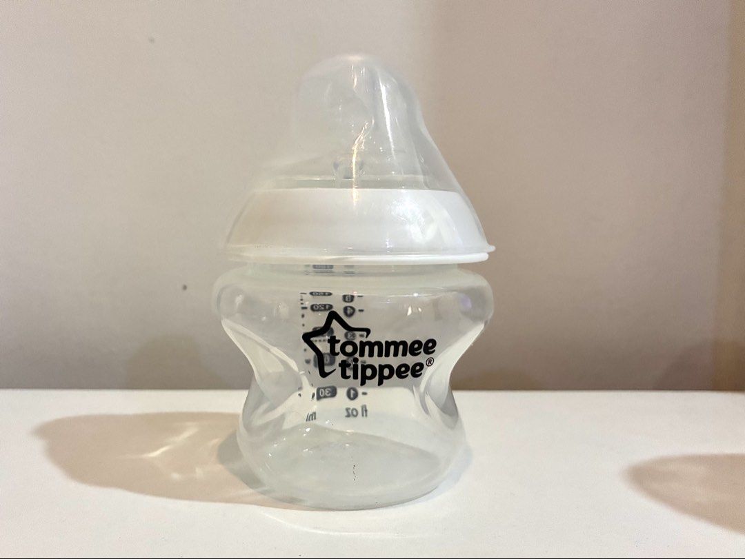 Tommee Tippee Feeding Bottle 150ml / 5oz 0m+ (Category: Breastfeeding & Bottle Feeding) located in Cagayan de Oro. Submitted by xxadl (Listing ID 1461326966, Image 2). Description: - Tommee Tippee Feeding Bottle - Capacity: 150ml (5oz) - Suitable from birth (0m+) - Includes teat and cap - Easy-grip shape for comfortable handling - Clear measurement markings on the side.