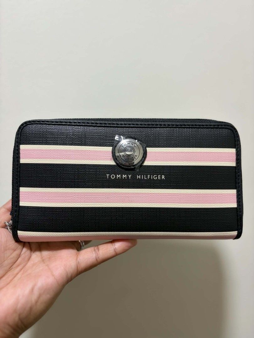 Tommy Hilfiger Long Wallet (Category: Wallets & Card holders) located in Manila. Submitted by kpfcarts (Listing ID 1461364554, Image 2). Description: Zip Around Continental / Long Wallet Horizontal Black, Pink and White Stripes Approx Size: 17.8cm x 10.2cm x 2.5cm.