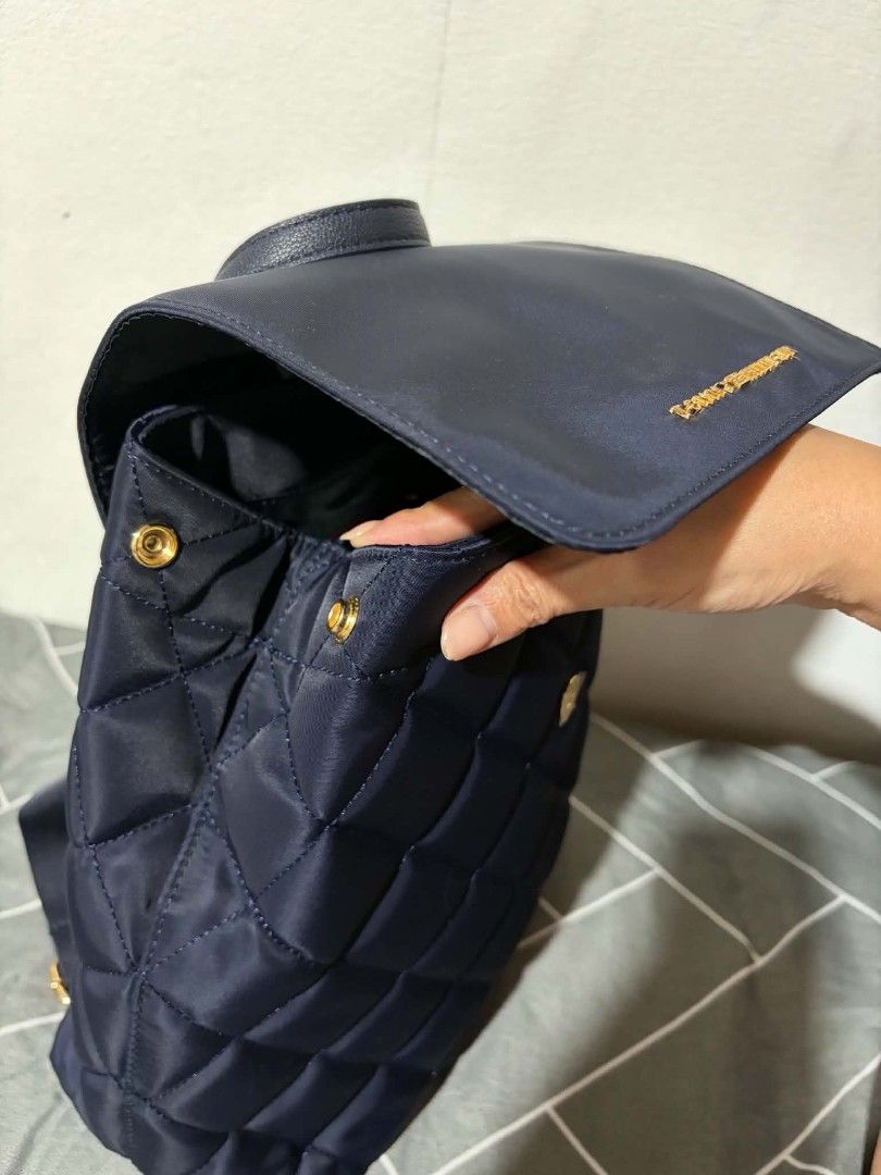 Tommy Hilfiger Quilted Nylon Backpack Navy Blue (Category: Backpacks) located in Pateros City. Submitted by armcandystuff (Listing ID 1461455713, Image 2). Description: - Navy blue quilted backpack - Authentic Tommy Hilfiger with gold logo - Secure snap button flap closure - Adjustable shoulder straps for comfort - Ideal for everyday adventures or getaways.