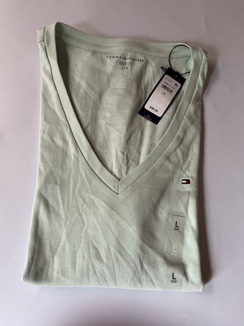 Tommy Hilfiger Vneck Shirt (Category: Shirts) located in Santa Rosa. Submitted by ninaparis (Listing ID 1461404188, Image 2). Description: Original Tommy Hilfiger Vneck Tshirt size Large can fit to Medium size cotton stretch.