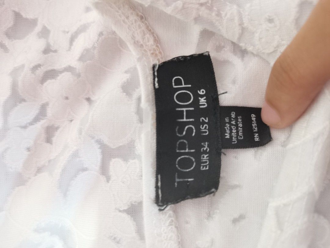 Topshop White Lace Cap Sleeve Top (Category: Blouses) located in Dipolog. Submitted by true.brclo_thing (Listing ID 1461442451, Image 2). Description: - White lace top from Topshop - Features cap sleeves - Slightly scalloped hem detail - Perfect for dressing up or down - Easily pairs with skirts or trousers.