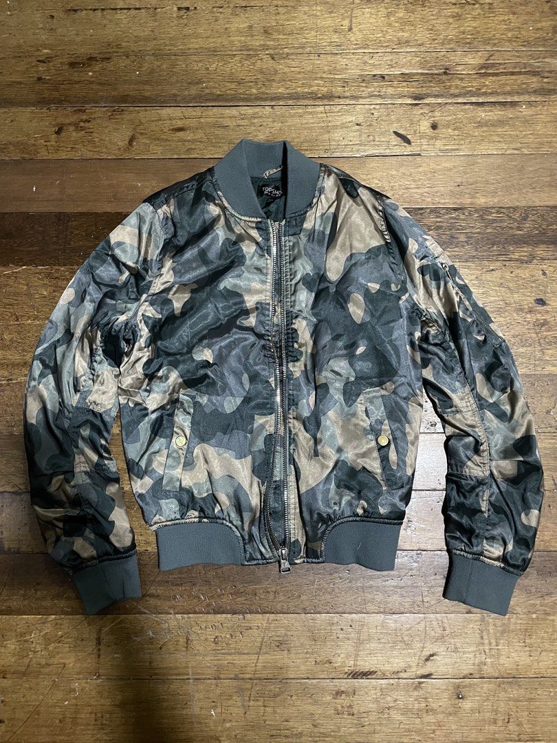 Topshop Women’s Bomber Jacket (Category: Coats, Jackets and Outerwear) located in Mandaluyong City. Submitted by _mksmt (Listing ID 1461374098, Image 1). Description: -camouflage bomber jacket -no flaws -ready to use PHP 500 ONLY.