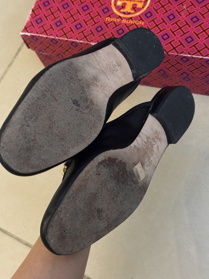 Tory Burch Mules (Category: Flats & Sandals) located in Pasay City. Submitted by shop.stylestaple (Listing ID 1461366011, Image 3). Description: - Tory Burch Black Leather Chain Mules with Box - Black leather Tory Burch mules - Gold chain detail across vamp with Tory Burch charm - Slip-on style - Soles show some wear but well taken care of - Comes with original Tory Burch box - bought in the US.