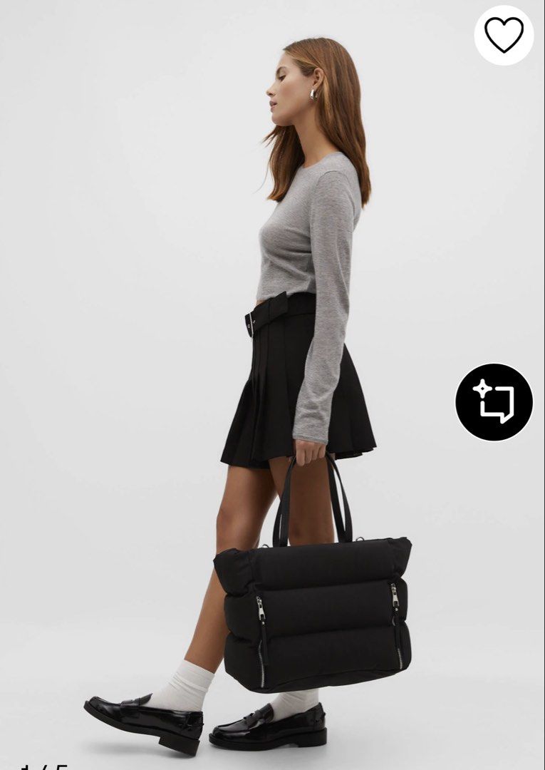 Tote bag (Category: Tote Bags) located in Pototan. Submitted by tres_190725 (Listing ID 1461512885, Image 1). Description: This item is the Stradivarius Tote Bag with Zips in black. It is a popular, lightweight utility travel shopper bag from the brand Stradivarius, constructed from a smooth nylon/polyamide fabric. It features a distinctive horizontal padded panel construction, thin twin shoulder straps, and prominent vertical zippers on the fron