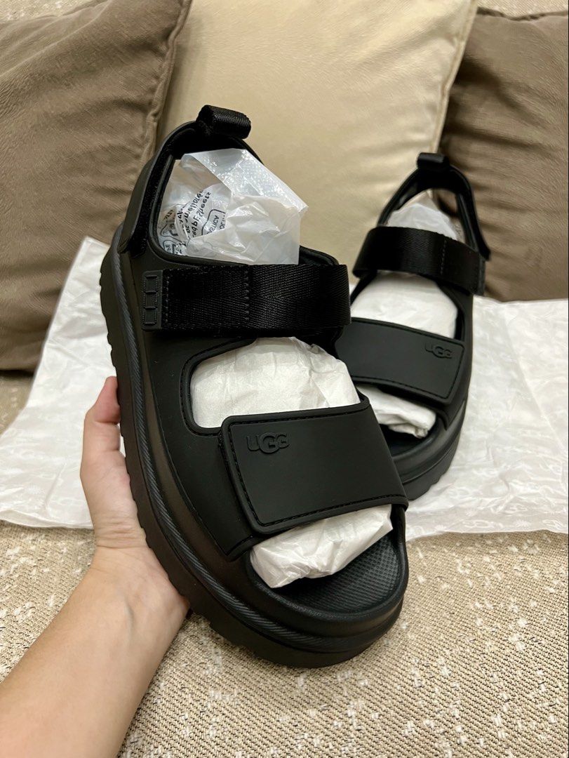 UGG Golden Glow Sandals S8W Black (Category: Flats & Sandals) located in Tarlac. Submitted by deecm (Listing ID 1461377789, Image 1). Description: - Brand new UGG Golden Glow sandals - Color: Black - Size: S8W - Never worn - Reason for selling: Too big - No Box.