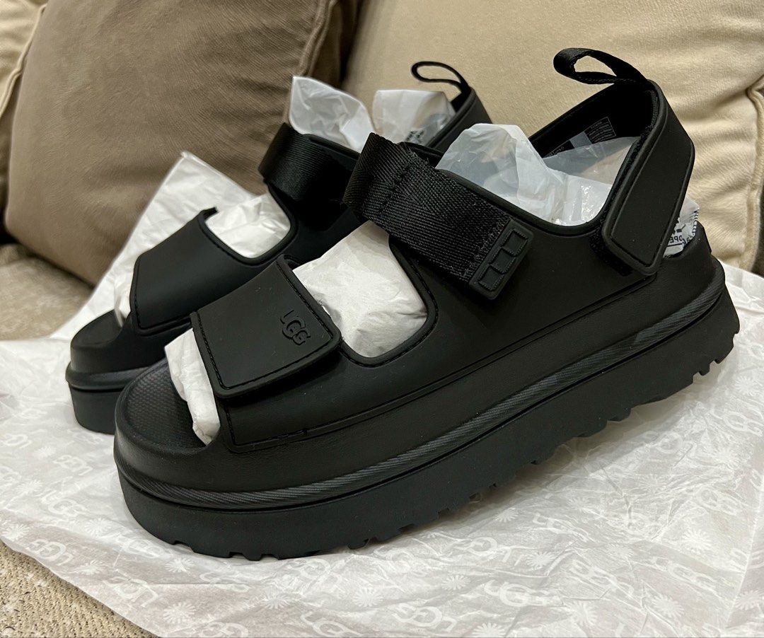 UGG Golden Glow Sandals S8W Black (Category: Flats & Sandals) located in Tarlac. Submitted by deecm (Listing ID 1461377789, Image 2). Description: - Brand new UGG Golden Glow sandals - Color: Black - Size: S8W - Never worn - Reason for selling: Too big - No Box.