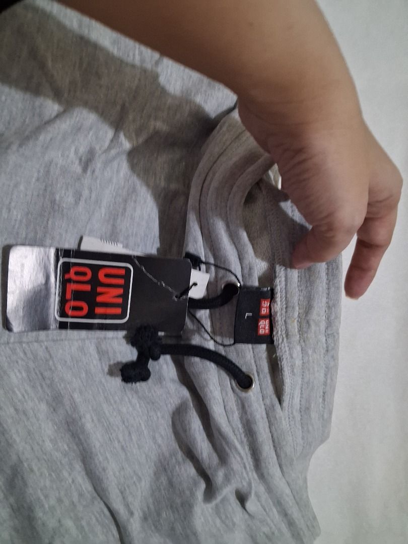 Uniqlo Grey Sweatpants with Drawstring (Category: Other Bottoms) located in Manila. Submitted by katkween23 (Listing ID 1461353360, Image 2). Description: - Brand: Uniqlo - Color: Grey - Size: L - Condition: Brand new with tags attached - Features: Drawstring waist, black trim - Ideal for: Lounging, casual wear.