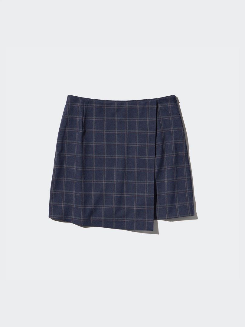 Uniqlo Navy Plaid Wrap Skort (Category: Skirts) located in Las Pinas. Submitted by miffy256 (Listing ID 1461336984, Image 1). Description: UniqloNavy Plaid Wrap Skort - Size: S - Color: Navy Blue with plaid pattern - Wrap design with inner shorts - With 2 side pockets - Side zipper closure.