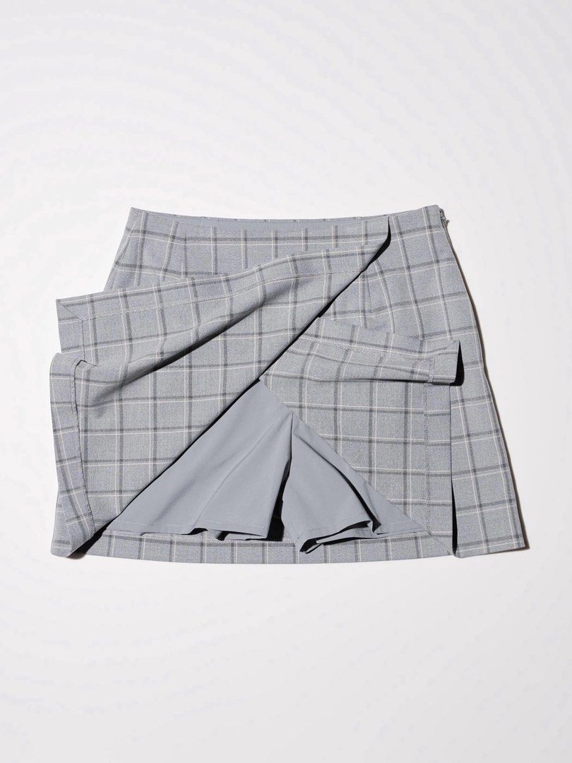 Uniqlo Navy Plaid Wrap Skort (Category: Skirts) located in Las Pinas. Submitted by miffy256 (Listing ID 1461336984, Image 2). Description: UniqloNavy Plaid Wrap Skort - Size: S - Color: Navy Blue with plaid pattern - Wrap design with inner shorts - With 2 side pockets - Side zipper closure.