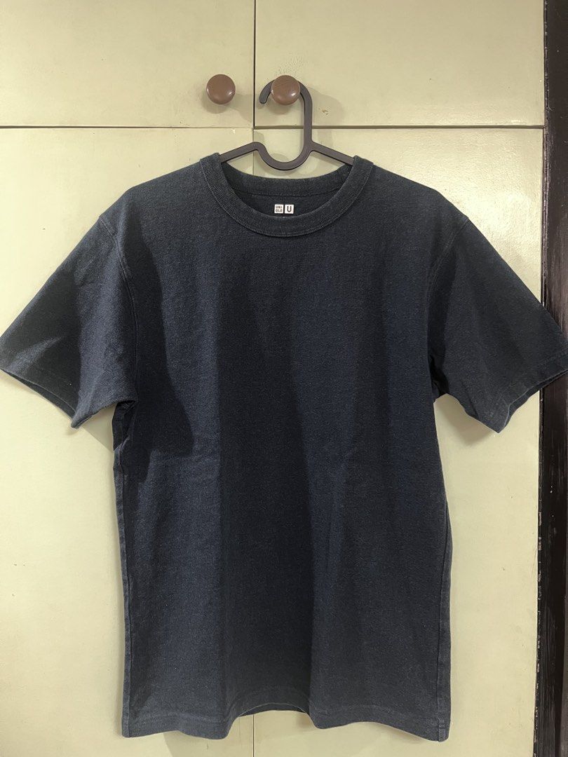 Uniqlo U Crew Neck (Category: Tshirts & Polo Shirts ) located in Taguig. Submitted by renzoquibael (Listing ID 1461339914, Image 1). Description: - Navy blue Uniqlo U t-shirt - Basic crew neck style - Made in Cambodia - Ideal for everyday wear - Simple and comfortable design.