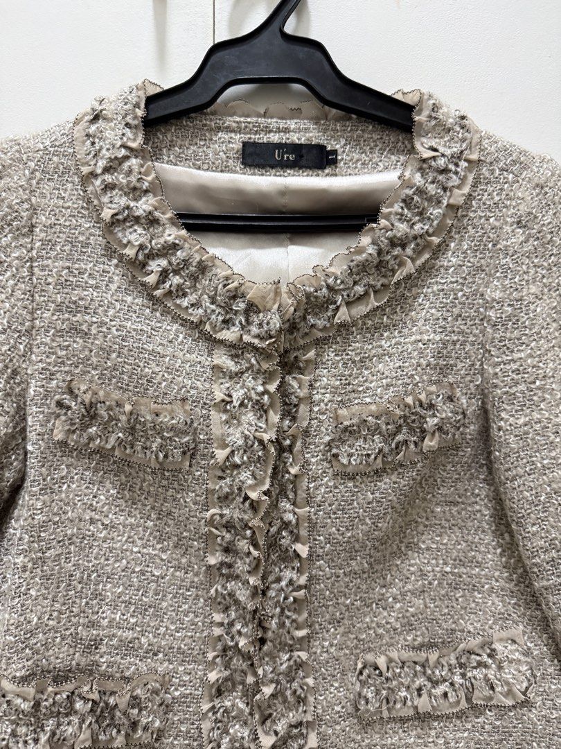 U're Tweed Jacket with Ruffle Trim (Category: Coats, Jackets and Outerwear) located in Noveleta. Submitted by andreapallera (Listing ID 1461482613, Image 2). Description: - Tweed jacket from Ure. - Features a pretty ruffle trim along the neckline and front opening. - Looks great with dresses or trousers..