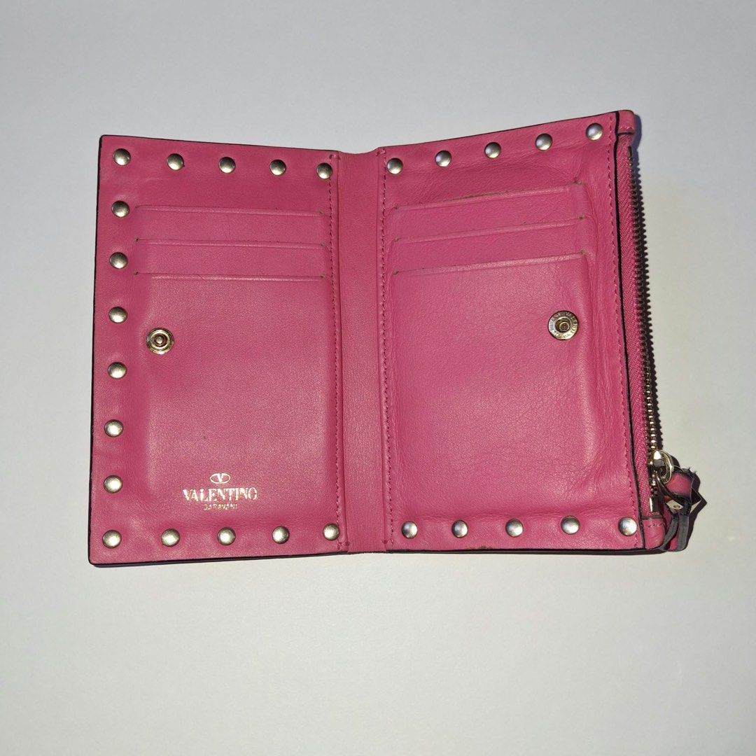Valentino Pink Studded Leather Wallet (Category: Luxury Bags & Wallets) located in Manila. Submitted by Mimi020623 (Listing ID 1461345924, Image 2). Description: - Authentic Pink Valentino Wallet - Genuine Leather with Signature Stud Details - Secure Zipper Closure - Interior Card Slots and Snap Button Compartment - Made in Italy - Approximate Dimensions: 4.5 x 3.5 inches.