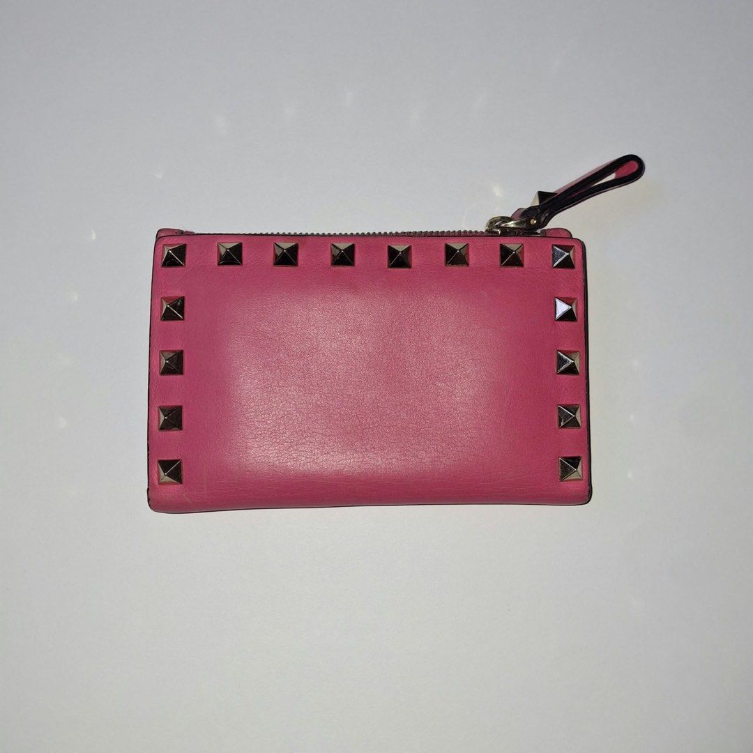 Valentino Pink Studded Leather Wallet (Category: Luxury Bags & Wallets) located in Manila. Submitted by Mimi020623 (Listing ID 1461345924, Image 3). Description: - Authentic Pink Valentino Wallet - Genuine Leather with Signature Stud Details - Secure Zipper Closure - Interior Card Slots and Snap Button Compartment - Made in Italy - Approximate Dimensions: 4.5 x 3.5 inches.