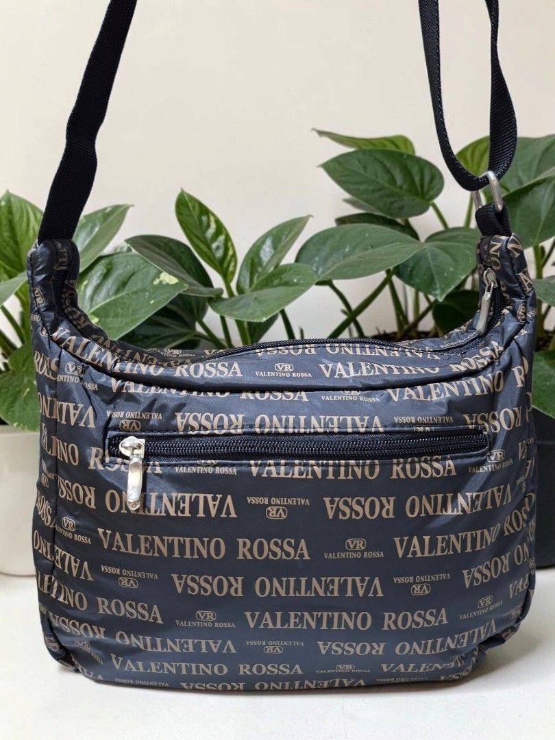 VALENTINO ROSSA MONOGRAM PUFF NYLON CROSSBODY (Category: Cross-body Bags) located in Las Pinas. Submitted by annachiaonair2037 (Listing ID 1461493722, Image 3). Description: VALENTINO ROSSA MONOGRAM PUFF NYLON CROSSBODY FROM JAPAN ADJUSTABLE STRAP LIKE NEW H 8.5" L 11" W 4" Disclaimer: I am not affiliated with, associated with, or authorized by any of the brands featured posted. Any mention of brand names, trademarks, or logos is solely for ident