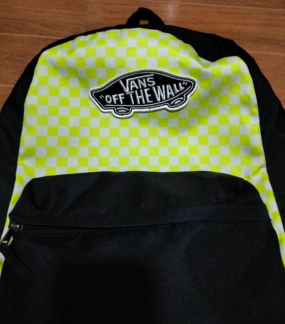 Vans Off The Wall Checkerboard Backpack (Category: Backpacks) located in Mangaldan. Submitted by niftythrifty69 (Listing ID 1461411985, Image 3). Description: - Classic Vans backpack - Iconic neon green checkerboard pattern on front - Black body with front zip pocket - Main compartment with internal pockets - Adjustable straps - Ideal for school or everyday use.