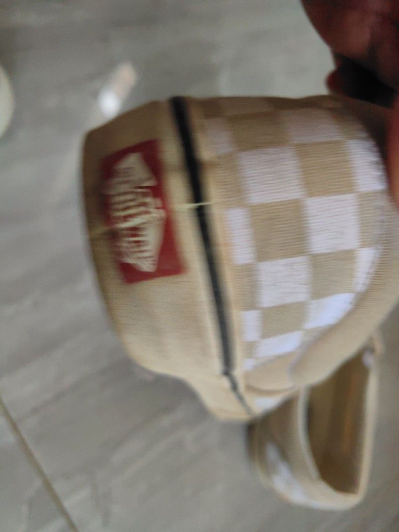 Vans Slip-On Checkerboard Tan White Shoes (Category: Sneakers) located in Quezon City. Submitted by flat.earther23 (Listing ID 1461342337, Image 3). Description: - Original Classic Vans slip-on shoes - Tan and white checkerboard pattern - Easy slip-on design - Vans logo on insole and heel tab - Soles show some wear, adding character - Ideal for everyday casual wear.