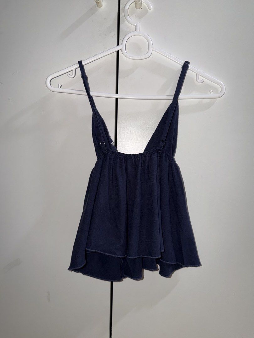 Vigoss Flowy Top (Category: Sleeveless) located in Manila. Submitted by closetbykiks (Listing ID 1461431055, Image 3). Description: Brand: VIGOSS Size: Medium (M) but can fit Small too Color: Navy Blue Fabric Content: 82% Rayon, 15% Linen, 3% Cotton Features: Deep V-neckline with silver eyelet/stud trim, empire waist, elasticated low back, thin adjustable shoulder straps, flowing peplum hem Condition: Excellent pre-owned condition Styling Suggest