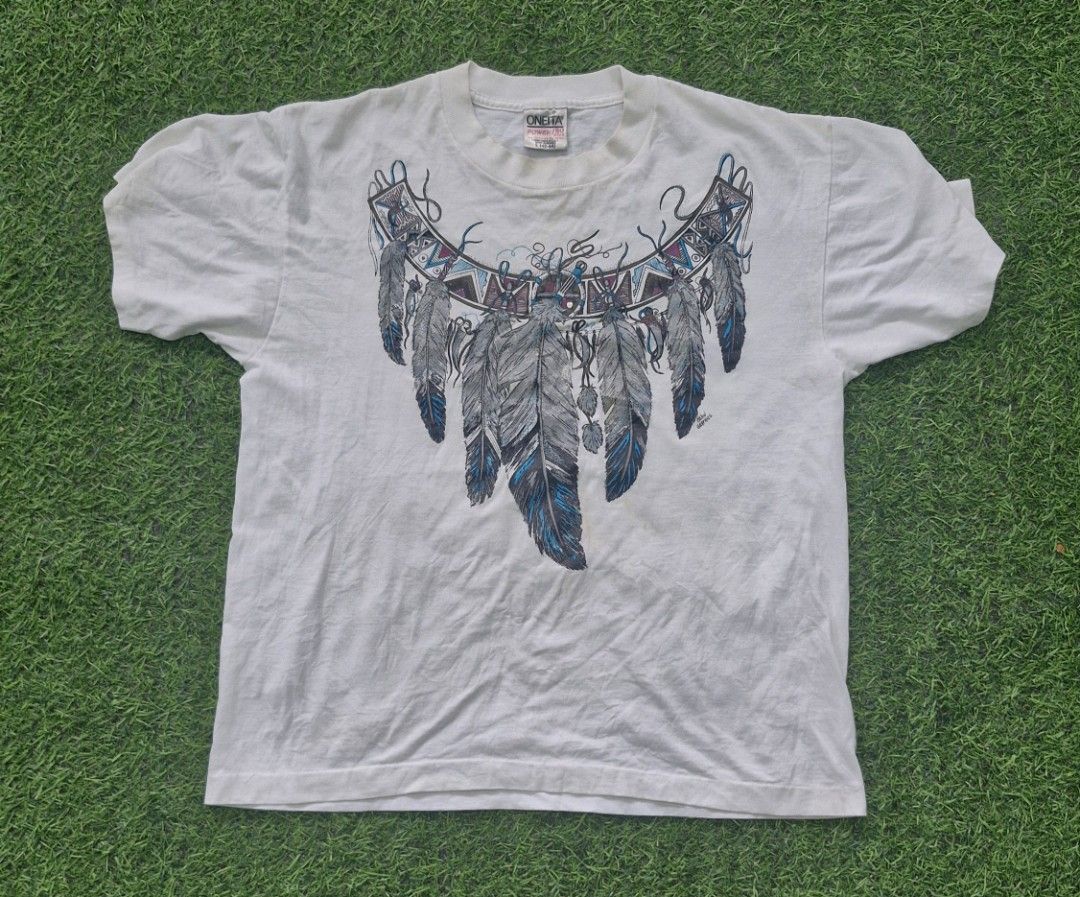 Vintage american native michel grapics tee (Category: Tshirts & Polo Shirts ) located in Pili. Submitted by the_g_thrift (Listing ID 1461380959, Image 1). Description: size large dimes: 21 x 25.5 single stitch all the way need wash.