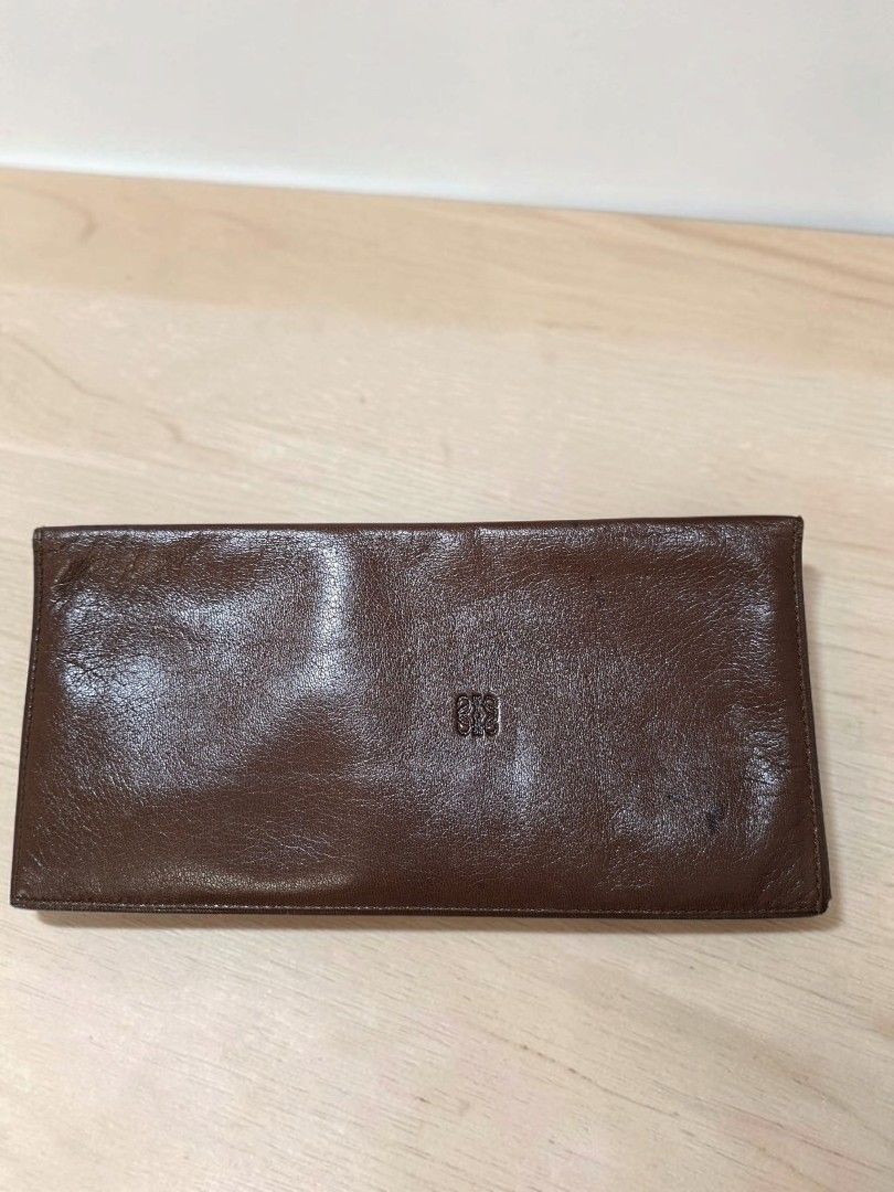 VINTAGE AUTHENTIC LOEWE LEATHER CHECKBOOK HOLDER WALLET (Category: Wallets & Card holders) located in Las Pinas. Submitted by annachiaonair2037 (Listing ID 1461373000, Image 1). Description: VINTAGE AUTHENTIC LOEWE LEATHER CHECKBOOK HOLDER WALLET FROM JAPAN GENUINE SOFT LEATHER NORMAL SIGN OF USAGE OF VINTAGE PIECE ON LEATHER BUT NO CRACKS, TEAR. Disclaimer: I am not affiliated with, associated with, or authorized by any of the brands featured po