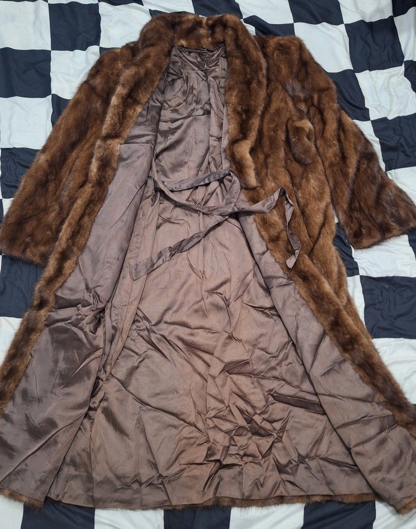 Vintage Brown Mink Fur Long Coat (Category: Coats, Jackets and Outerwear) located in Puerto Princesa. Submitted by jercksthriftph (Listing ID 1461381245, Image 3). Description: - Elegant long brown fur coat, with a luxurious mink-like appearance. - Smooth satin lining for added comfort. - Includes a stylish tie belt for a customizable fit. - Features a wide, statement collar. - Full-length sleeves provide complete coverage. - Ideal for keeping wa