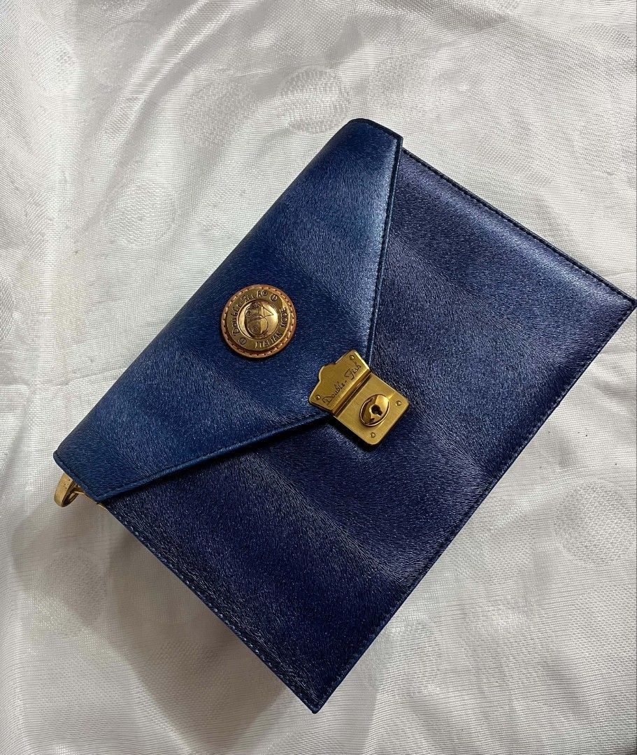Vintage Double Fish Bag (Category: Shoulder Bags) located in Imus. Submitted by mgracev (Listing ID 1461401897, Image 1). Description: Selling my Vintage Double Fish Bag - Mint Condition – rarely used - Navy blue with tan leather accents - Can be worn as shoulder/crossbody bag - with adjustable strap - All closures, hardware, straps anz zippers are in good condition - with signature double fish keyring/coin purse .
