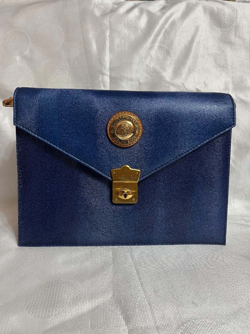Vintage Double Fish Bag (Category: Shoulder Bags) located in Imus. Submitted by mgracev (Listing ID 1461401897, Image 2). Description: Selling my Vintage Double Fish Bag - Mint Condition – rarely used - Navy blue with tan leather accents - Can be worn as shoulder/crossbody bag - with adjustable strap - All closures, hardware, straps anz zippers are in good condition - with signature double fish keyring/coin purse .