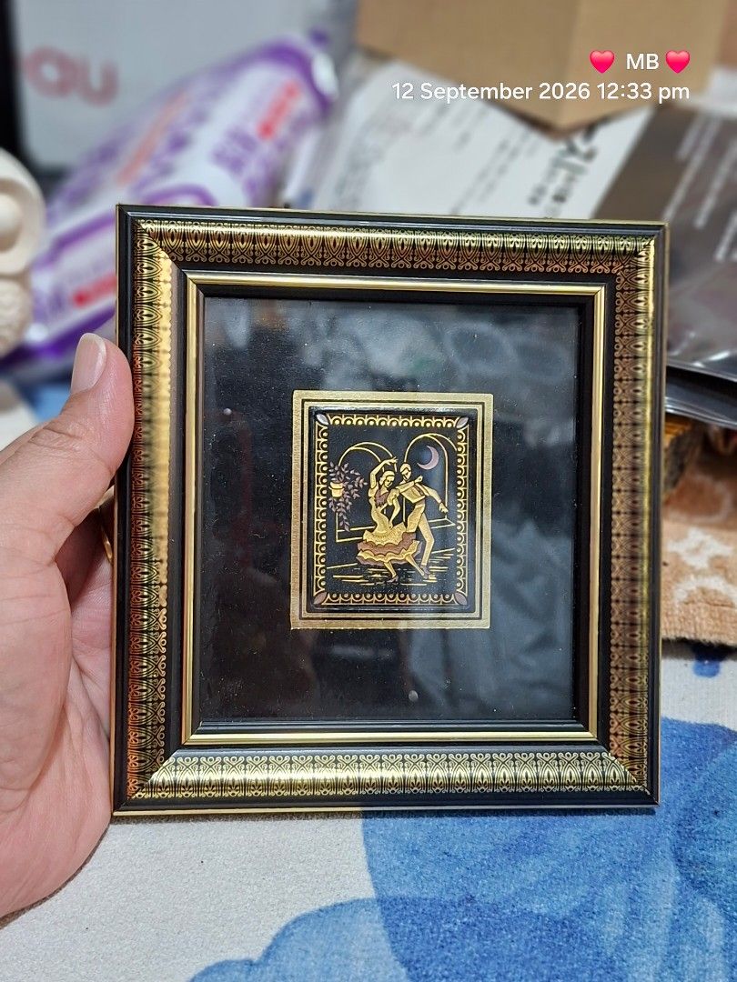 Vintage Framed Artwork with Couple Dancing (Category: Frames & Pictures) located in Lucena. Submitted by dai_suki (Listing ID 1461336341, Image 1). Description: - Small framed artwork featuring a couple dancing. - Elegant black and gold frame with intricate patterns. - Artwork has a unique metallic sheen. - Dimensions: Approximately 6 inches by 6 inches. - Ideal as a gift or for personal art collection..