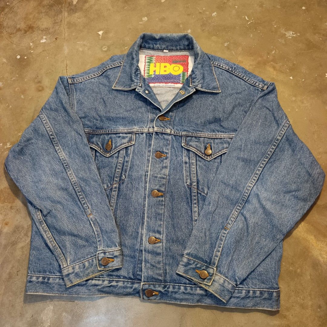 Vintage HBO Denim Jacket (Category: Coats, Jackets and Outerwear) located in Currimao. Submitted by jerson120 (Listing ID 1461364677, Image 1). Description: - Classic blue denim jacket - Features an authentic HBO tag inside - Button-up front closure - Button cuffs for adjustable fit - Standard, comfortable fit - Ideal for HBO enthusiasts and collectors - A stylish addition to any casual wardrobe.