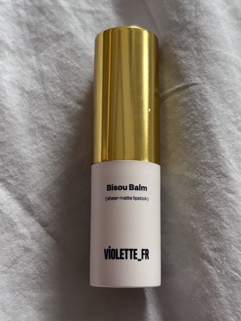 Violette Fr Bisou Balm (Category: Makeup) located in Pasig City. Submitted by missclosetcleanup (Listing ID 1461401656, Image 2). Description: - VIOLETTE_FR Bisou Balm - Shade: Calisson - Finish: Sheer matte lipstick - Features: Gold cap, original packaging - Ideal for: Achieving a natural makeup look.