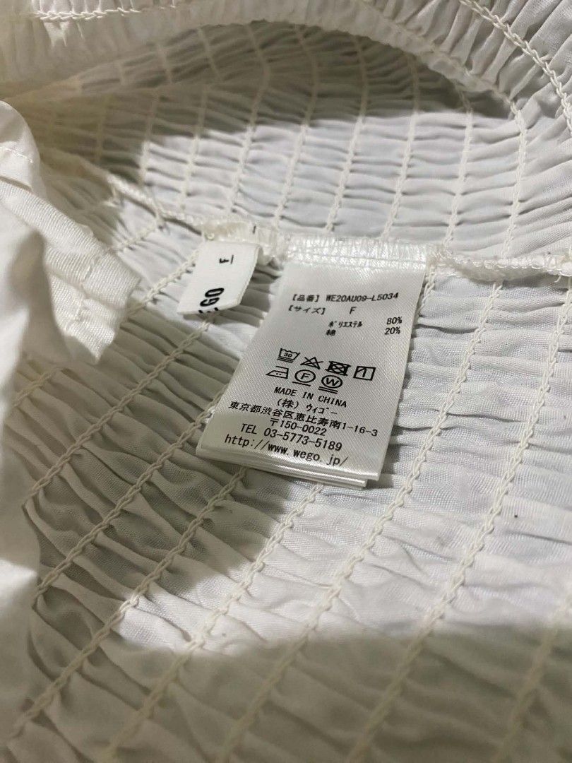 Wego White Smocked Puff-Sleeve Blouse (Category: Longsleeves) located in Binan City. Submitted by katespanie (Listing ID 1461341772, Image 2). Description: Good pre-loved condition. Maayos pa overall and walang obvious na major stains, holes, or damages. May konting wrinkles/creases lang from storage or handling, pero okay pa yung smocked details and sleeves. Clean and presentable pa siya. 📍 Location: LAGUNA 🚚 Lalamove delivery available. 💸 Sh
