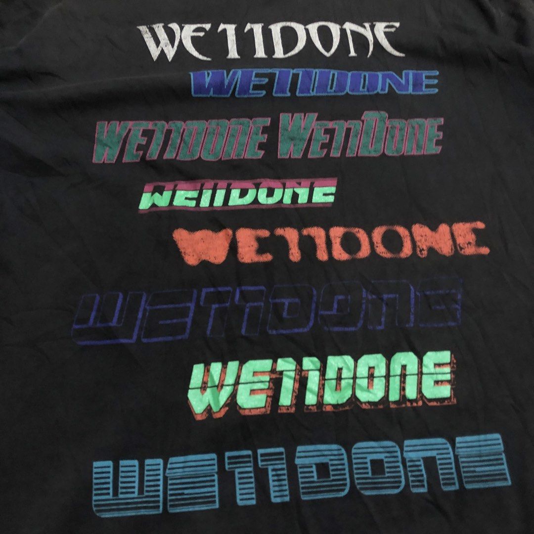 WET11DONE Graphic T-Shirt (Category: Tshirts & Polo Shirts ) located in Dasmarinas. Submitted by johnlloydm99208 (Listing ID 1461546581, Image 2). Description: - Grey t-shirt - Features multiple 'WET11DONE' graphic prints in various colors and fonts - Layered and textured prints - Crew neck, short sleeves - Estimated size: Medium or Large - Perfect statement piece.