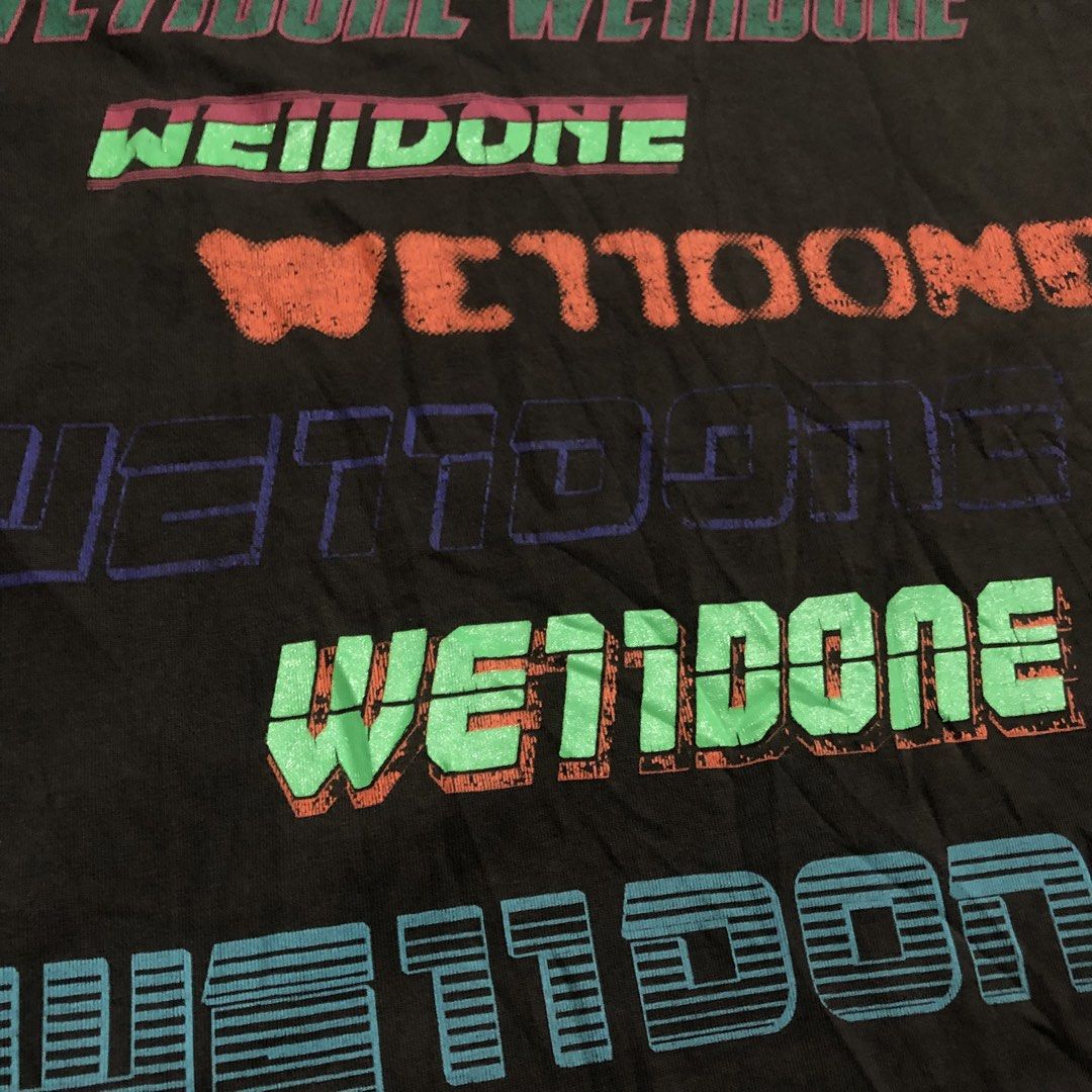 WET11DONE Graphic T-Shirt (Category: Tshirts & Polo Shirts ) located in Dasmarinas. Submitted by johnlloydm99208 (Listing ID 1461546581, Image 3). Description: - Grey t-shirt - Features multiple 'WET11DONE' graphic prints in various colors and fonts - Layered and textured prints - Crew neck, short sleeves - Estimated size: Medium or Large - Perfect statement piece.