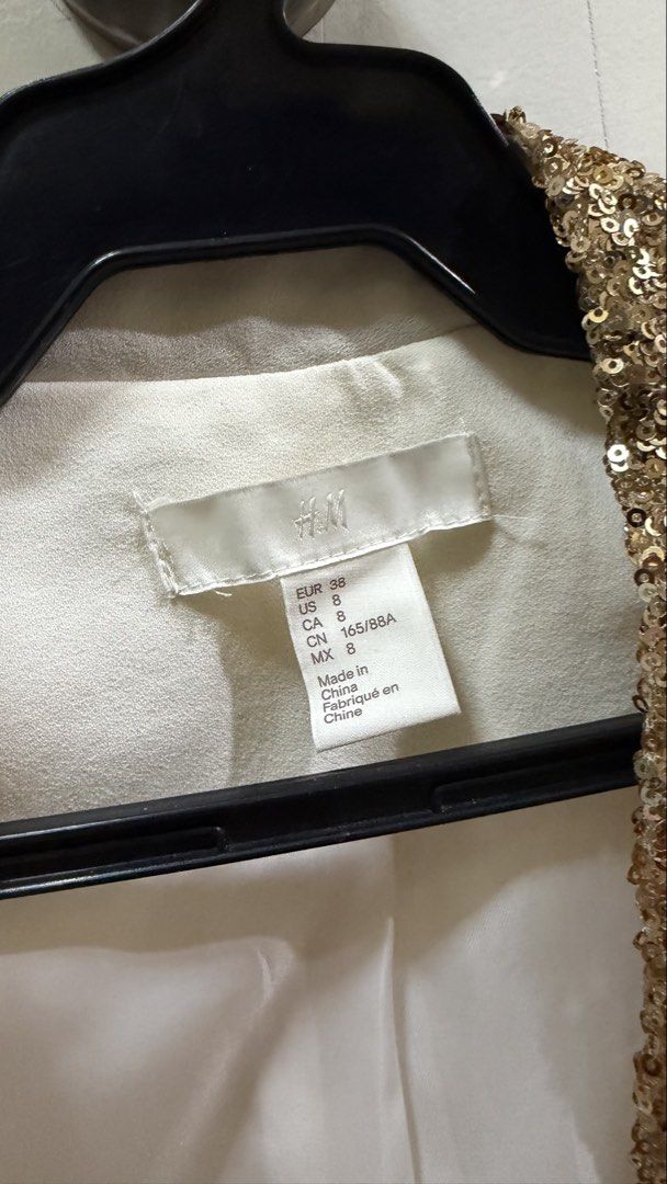 Cream Blazer Lined With Gold Sequins (Category: Coats, Jackets and Outerwear) located in San Juan City. Submitted by kassyjsn (Listing ID 1461533417, Image 3). Description: - Brand: H&M - Item: Cream Blazer - Design: Lined with shimmering gold sequins - Size: Medium (EU 38 / UK 10 / US 6) - Perfect for adding a glamorous touch to any outfit - Price is negotiable :).