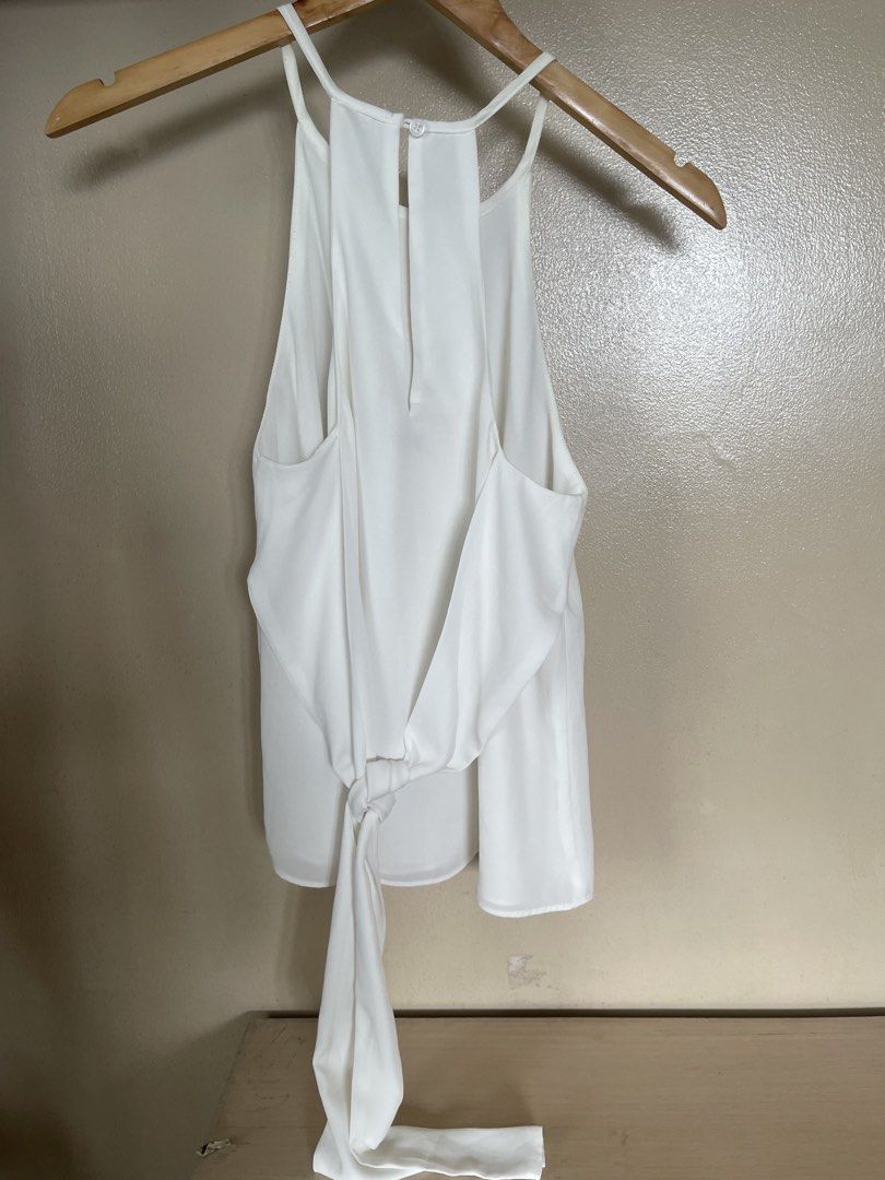 white high neck sleeveless (Category: Sleeveless) located in Quezon City. Submitted by booktt (Listing ID 1461371845, Image 2). Description: tie back detail.