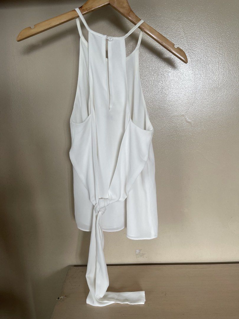 white high neck sleeveless (Category: Sleeveless) located in Quezon City. Submitted by booktt (Listing ID 1461371845, Image 3). Description: tie back detail.