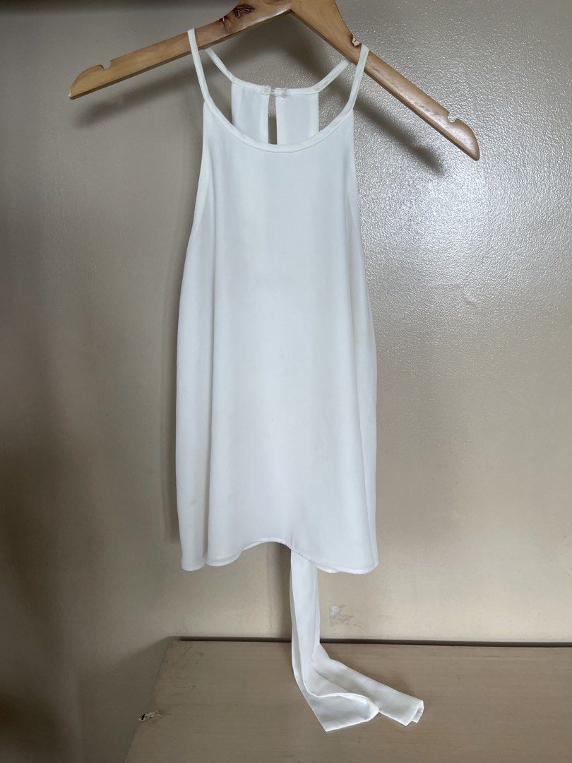 white high neck sleeveless (Category: Sleeveless) located in Quezon City. Submitted by booktt (Listing ID 1461371845, Image 1). Description: tie back detail.