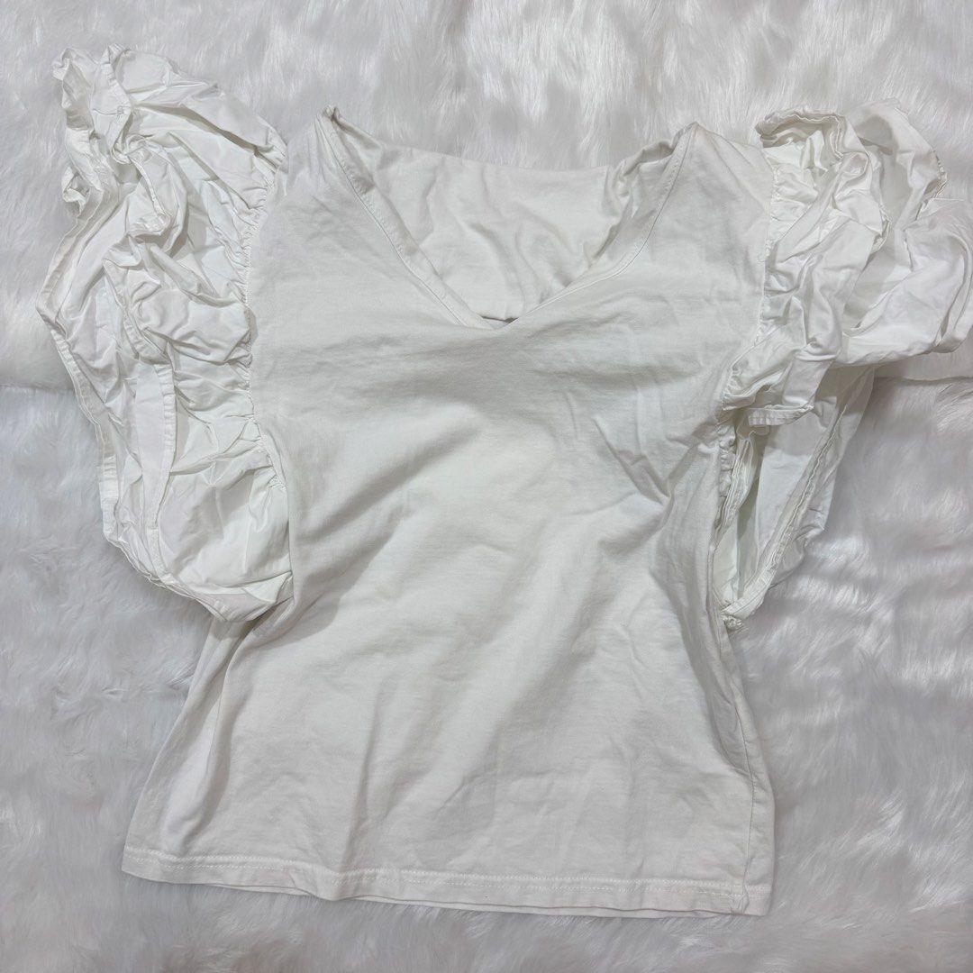 Zara White Puff Sleeve V-Neck Top (Category: Blouses) located in Legazpi City. Submitted by lezarellesque (Listing ID 1461440229, Image 2). Description: Washtags/tags removed, thus the low price. Please read :)) 1. Kindly refrain from asking for when worn photos. I will include them in the listing if I have, or if I was able to get one from the product website, like this photo here. 2. Last price posted as I bought these at higher costs and I bar