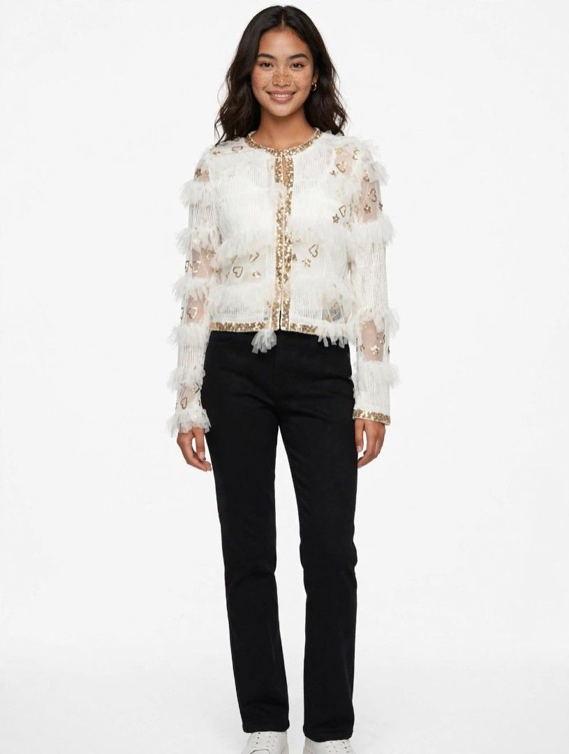 White Sequin Jacket with Ruffles and Gold Heart Details (Category: Coats, Jackets and Outerwear) located in Manila. Submitted by tinygazo90639 (Listing ID 1455860645, Image 1). Description: - Eye-catching white jacket with a sequin base. - Features voluminous ruffles on sleeves and shoulders. - Adorned with scattered gold heart and star embellishments. - Elegant gold sequin trim along the neckline and front opening. - Secure button closure. - Ver