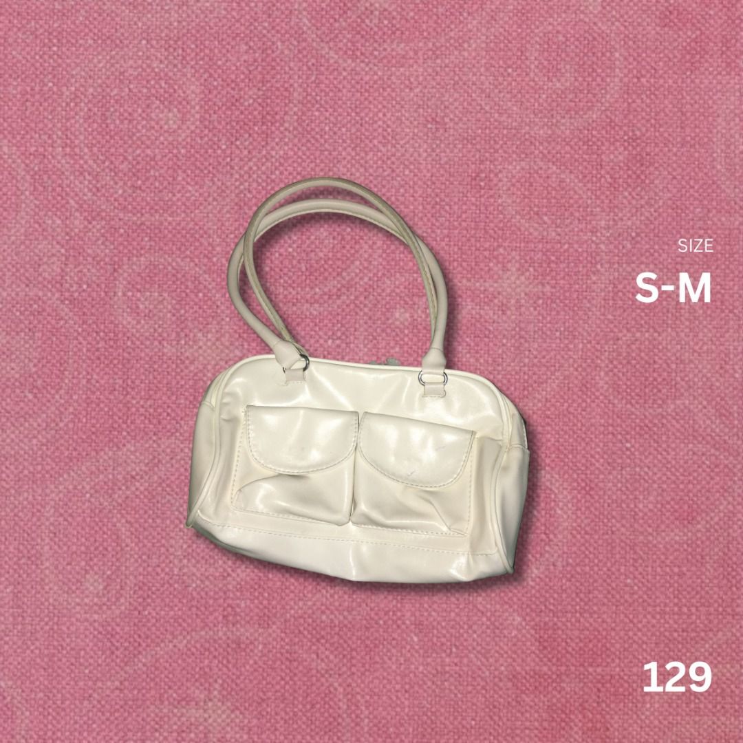 WHITE SHOULDER BAG (Category: Shoulder Bags) located in Manila. Submitted by j.saell (Listing ID 1461368105, Image 1). Description: 129 Size: S-M Loc: Sampaloc Manila Issue: may sirang tahi sa bulsa part & may pen tint sa front MOD: Meet up/Lalamove.