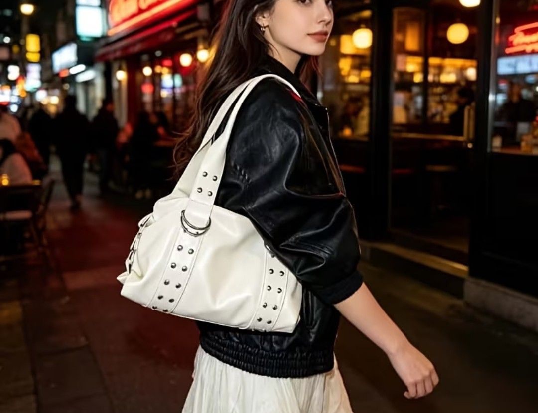 White Studded Shoulder Bag with Silver Hardware (Category: Luxury Bags & Wallets) located in Mariveles. Submitted by adhes28 (Listing ID 1461434009, Image 2). Description: - Chic white shoulder bag - Elegant silver hardware (studs & rings) - Secure zipper closure - Thick, durable handles - Versatile for casual outings or evening events - Very stylish and eye-catching.