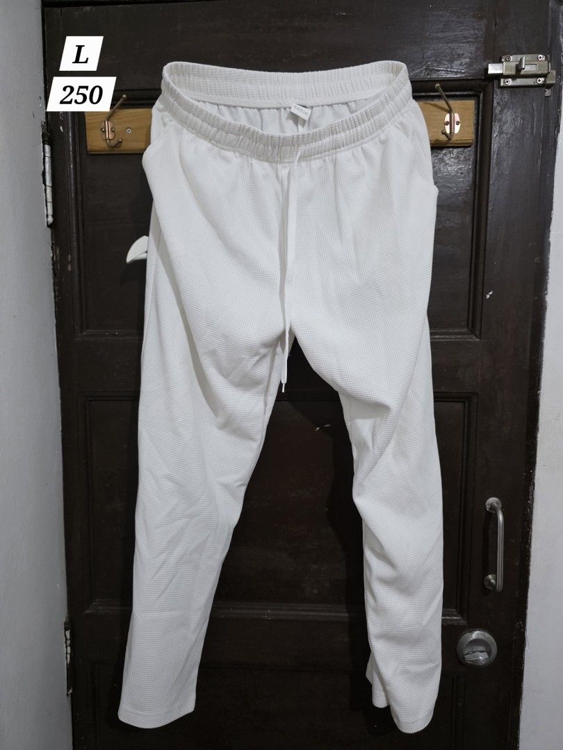 White Textured Joggers Size L (Category: Other Bottoms) located in Pasay City. Submitted by deal.point (Listing ID 1461437586, Image 1). Description: - White joggers with unique waffle-like texture - Comfortable elastic waistband with adjustable drawstring - Relaxed fit, perfect for casual outings or lounging - Size: Large (L) to xl 33 t34 wait stretchable .