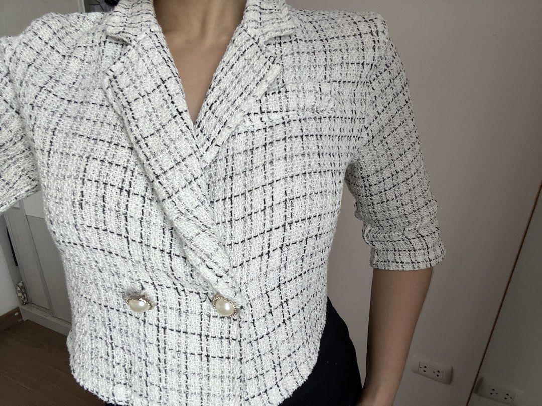 White Tweed Cropped Double-Breasted Blazer (Category: Coats, Jackets and Outerwear) located in Makati City. Submitted by warm.abc123 (Listing ID 1461405850, Image 3). Description: - White tweed cropped blazer - Black and silver thread details - Double-breasted front - Pearl button closure - Cropped length (hits at waist) - Three-quarter sleeves - Chic and sophisticated style - Versatile for dressing up or down.