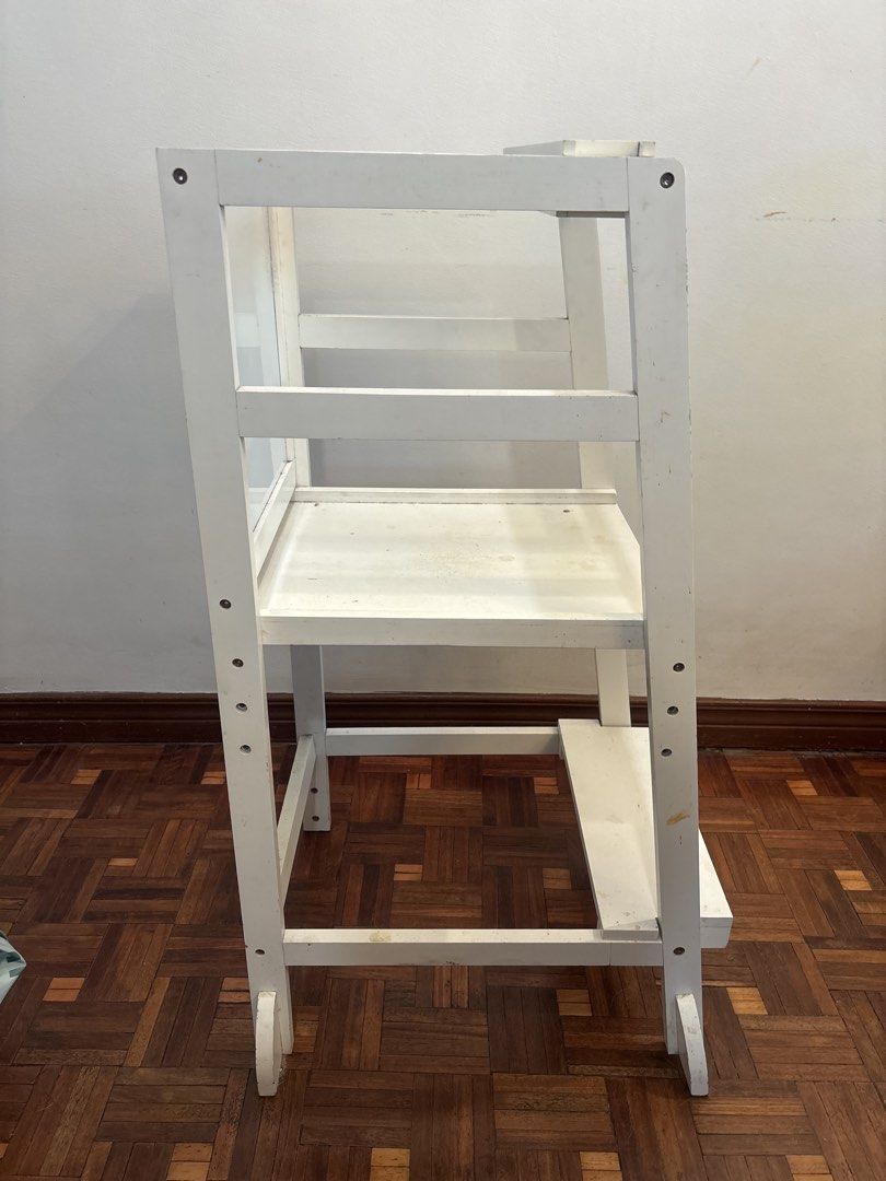 White Wooden Learning Tower with Chalkboard (Category: Other Kids Furniture) located in Manila. Submitted by decluttering0117 (Listing ID 1461329382, Image 2). Description: - White wooden learning tower - Built-in chalkboard on the back, interchangeable with whiteboard - Minor scuffs and marks from normal use - Ideal for kitchen activities and reaching high places - Retails for ~3k.