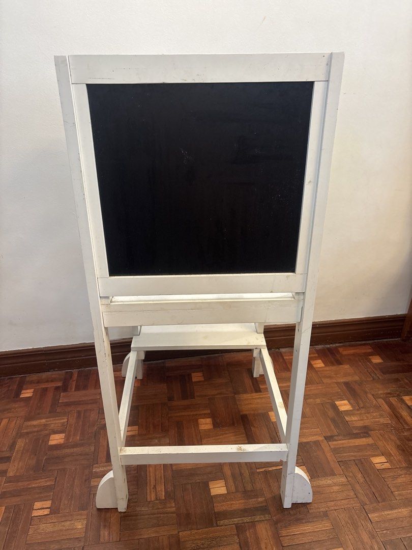 White Wooden Learning Tower with Chalkboard (Category: Other Kids Furniture) located in Manila. Submitted by decluttering0117 (Listing ID 1461329382, Image 3). Description: - White wooden learning tower - Built-in chalkboard on the back, interchangeable with whiteboard - Minor scuffs and marks from normal use - Ideal for kitchen activities and reaching high places - Retails for ~3k.