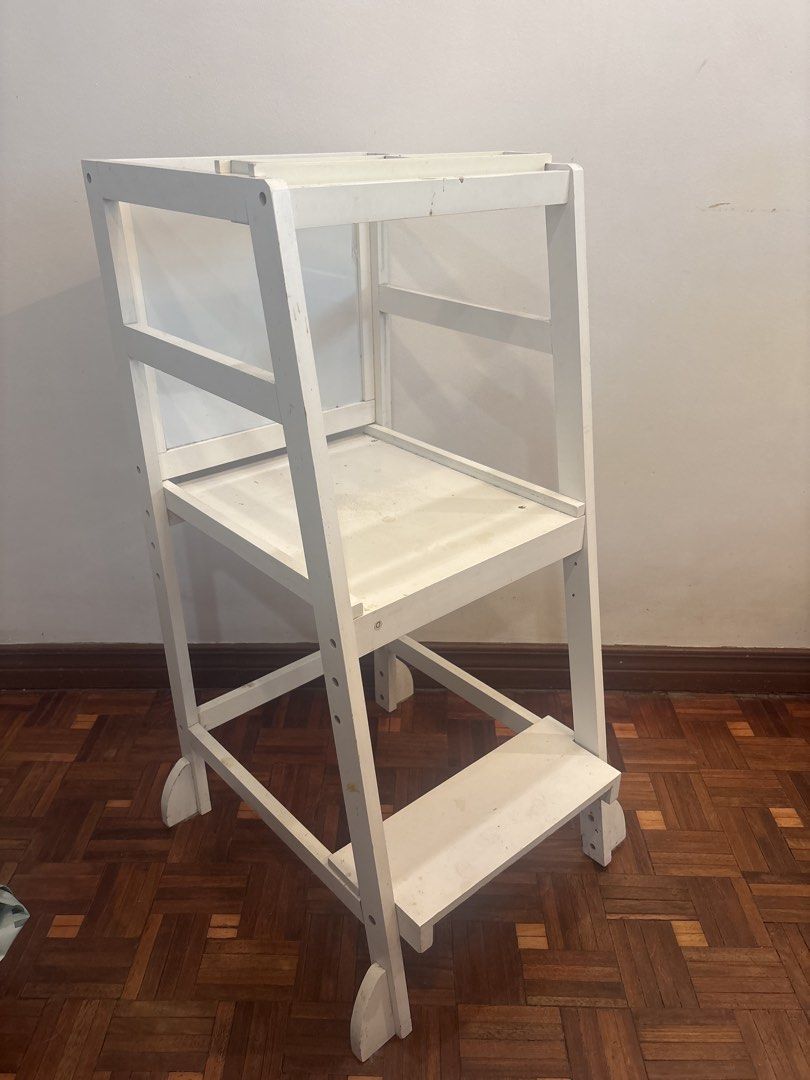 White Wooden Learning Tower with Chalkboard (Category: Other Kids Furniture) located in Manila. Submitted by decluttering0117 (Listing ID 1461329382, Image 1). Description: - White wooden learning tower - Built-in chalkboard on the back, interchangeable with whiteboard - Minor scuffs and marks from normal use - Ideal for kitchen activities and reaching high places - Retails for ~3k.