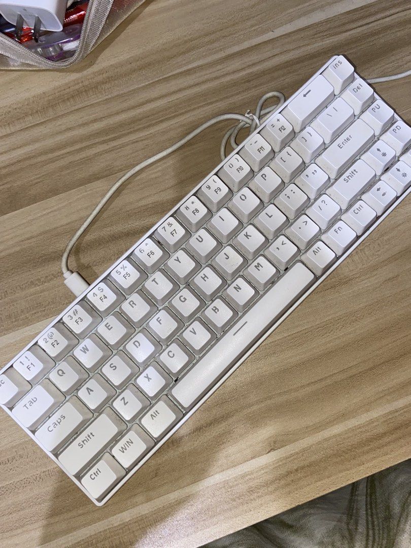 Wired Keyboard - White (Category: Computer Keyboard) located in Quezon City. Submitted by looselei (Listing ID 1461516222, Image 3). Description: *KEYCAPS ARE NOT REPLACEABLE!* with blue back light — have various light modes! USB wire type - can be used on PC or laptop with some issues like: - needs cleaning - few keys don’t have backlight anymore .